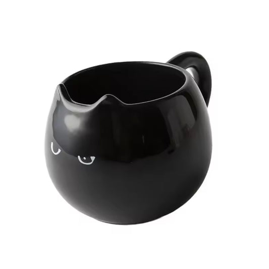 Adorable hand - painted cat - shaped ceramic mug, perfect for coffee or tea.