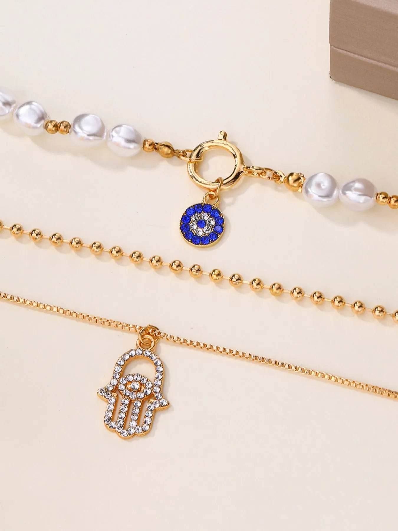 Layered Pearl Chain Evil Eye Hamsa Pendant Necklace - IntuitiveEncBoutique